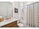 Bathroom with a vanity, toilet, and tub with shower with a decorative shower curtain at 1014 Umbria Dr, Kissimmee, FL 34759