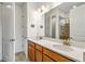 Modern bathroom with a double sink vanity, sleek fixtures, and ample counter space, offering a clean and functional design at 1014 Umbria Dr, Kissimmee, FL 34759