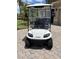 Modern electric golf cart boasts headlights and seats, perfect for cruising around the golf course or neighborhood at 1014 Umbria Dr, Kissimmee, FL 34759