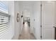 Bright hallway leads to an open-concept living space, offering seamless flow and modern design at 1014 Umbria Dr, Kissimmee, FL 34759