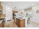 Bright kitchen featuring stainless steel appliances, a large island, and modern fixtures, perfect for entertaining at 1014 Umbria Dr, Kissimmee, FL 34759