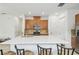 Well-appointed kitchen featuring a center island with seating, stainless steel appliances, and tiled backsplash at 1014 Umbria Dr, Kissimmee, FL 34759