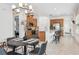 Bright eat-in kitchen with stainless steel appliances, island and breakfast bar adjacent to the dining room at 1014 Umbria Dr, Kissimmee, FL 34759