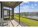 Charming lanai offering a peaceful outdoor retreat with views of lush lawn and neighborhood scenery at 1014 Umbria Dr, Kissimmee, FL 34759