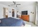 Spacious main bedroom features a calming lake view, with ceiling fan, easy access to the walk-in closet and the en-suite bathroom at 1014 Umbria Dr, Kissimmee, FL 34759