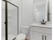 Bathroom with glass-enclosed shower, single sink vanity, and tile flooring at 1019 Cloud Ridge Ct, Mount Dora, FL 32757