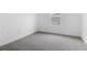 Carpeted bedroom with white walls and trim with a bright window at 1019 Cloud Ridge Ct, Mount Dora, FL 32757