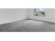 Bright bedroom with a window offering neighborhood views at 1019 Cloud Ridge Ct, Mount Dora, FL 32757