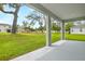 View from the back porch to a large grass backyard at 1067 Cloud Ridge Ct, Mount Dora, FL 32757