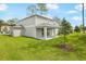 The backyard of the property including a covered patio area at 1067 Cloud Ridge Ct, Mount Dora, FL 32757