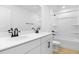 White bathroom with double sinks, granite countertops, and a shower and tub combination at 1067 Cloud Ridge Ct, Mount Dora, FL 32757
