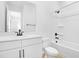 Bright bathroom with a shower and tub combination, with white fixtures and black hardware at 1067 Cloud Ridge Ct, Mount Dora, FL 32757