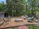 Spacious backyard features a fire pit, seating, and lush greenery at 1081 Se 174Th Ter, Silver Springs, FL 34488