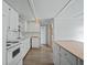 Functional kitchen featuring modern appliances, white cabinets, and an open design at 1081 Se 174Th Ter, Silver Springs, FL 34488
