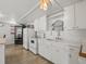 Functional kitchen featuring modern appliances, white cabinets, and an open design at 1081 Se 174Th Ter, Silver Springs, FL 34488