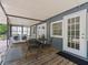 Charming screened-in porch with a dining set and laundry appliances at 1081 Se 174Th Ter, Silver Springs, FL 34488