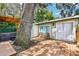 Outdoor deck with mature trees offers a tranquil seating area and hot tub access at 1104 E Anderson St, Orlando, FL 32801