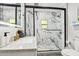 Modern bathroom featuring a marble tiled shower, vanity and updated fixtures at 1104 E Anderson St, Orlando, FL 32801