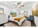 Bedroom featuring a modern bed, TV, ceiling fan and en-suite bathroom at 1104 E Anderson St, Orlando, FL 32801
