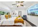 Bedroom featuring a modern bed, TV, ceiling fan and en-suite bathroom at 1104 E Anderson St, Orlando, FL 32801