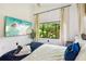 Bedroom featuring natural lighting, a modern tv and stylish decor at 1104 E Anderson St, Orlando, FL 32801