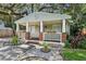 Charming home featuring a cozy front porch with brick accents, flower boxes and a landscaped front yard at 1104 E Anderson St, Orlando, FL 32801