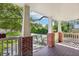Charming front porch with brick accents overlooking the paved driveway and front yard at 1104 E Anderson St, Orlando, FL 32801