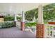 Charming front porch with brick accents overlooking the manicured front yard at 1104 E Anderson St, Orlando, FL 32801