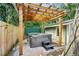 Backyard hot tub surrounded by pavers and a wooden pergola at 1104 E Anderson St, Orlando, FL 32801