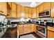 Well-lit kitchen with stainless steel appliances, ample counter space, and classic cabinetry at 1104 E Anderson St, Orlando, FL 32801
