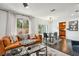 Open-concept living room with sliding doors and view to the outside, seamlessly connecting to the dining area at 1104 E Anderson St, Orlando, FL 32801