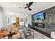 Open living space features modern fireplace, TV, sleek furnishings, and easy access to the kitchen at 1104 E Anderson St, Orlando, FL 32801