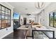 Spacious living room with modern decor, fireplace, TV, and view into the dining area at 1104 E Anderson St, Orlando, FL 32801