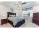 Comfortable bedroom featuring a large bed, plush bedding, and ample natural light at 1158 Oak Valley Dr, Auburndale, FL 33823