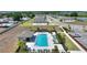 Inviting community pool area with lounge chairs, a shaded pavilion, and manicured landscaping at 1158 Oak Valley Dr, Auburndale, FL 33823