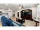 Cozy living room with a large television, comfortable sofa, and stylish decor at 1158 Oak Valley Dr, Auburndale, FL 33823