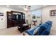 Bright living room with a plush sofa, large window, and elegant furniture and decor at 1158 Oak Valley Dr, Auburndale, FL 33823