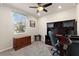 The office area features a ceiling fan, a computer desk, and a large window with blinds at 1158 Oak Valley Dr, Auburndale, FL 33823