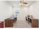 Bright room featuring a ceiling fan, and two wooden desks for crafting with natural light from the window at 1158 Oak Valley Dr, Auburndale, FL 33823