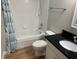 Bathroom featuring shower-tub combination, toilet, and vanity with granite countertop at 13226 Galicia St # 103, Orlando, FL 32824