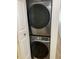 Closet with full-size stackable Samsung washer and dryer at 13226 Galicia St # 103, Orlando, FL 32824