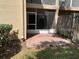 Screened patio featuring red brick pavers at 13226 Galicia St # 103, Orlando, FL 32824