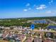 Neighborhood aerial view showcasing the home's location with a lake and the community at 1416 Lexington Ave, Davenport, FL 33837