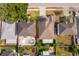 Aerial view of a home with a pool, fenced yard, and mature landscaping at 153 Pine Isle Dr, Sanford, FL 32773
