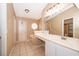 Bathroom featuring double sink vanity, tile flooring, and a octagon window at 153 Pine Isle Dr, Sanford, FL 32773