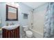 Bathroom with vanity, toilet, and shower-tub with shower curtain at 153 Pine Isle Dr, Sanford, FL 32773