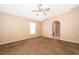 Cozy bedroom with carpet, neutral walls, ceiling fan and a arched entryway at 153 Pine Isle Dr, Sanford, FL 32773