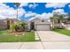 Charming single-story home with well-manicured lawn, inviting entrance, and a two car garage at 153 Pine Isle Dr, Sanford, FL 32773
