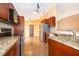 Kitchen featuring granite countertops, tile backsplash, and stainless steel appliances at 153 Pine Isle Dr, Sanford, FL 32773