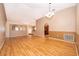 Spacious living room featuring hardwood floors, neutral walls, and a chandelier at 153 Pine Isle Dr, Sanford, FL 32773